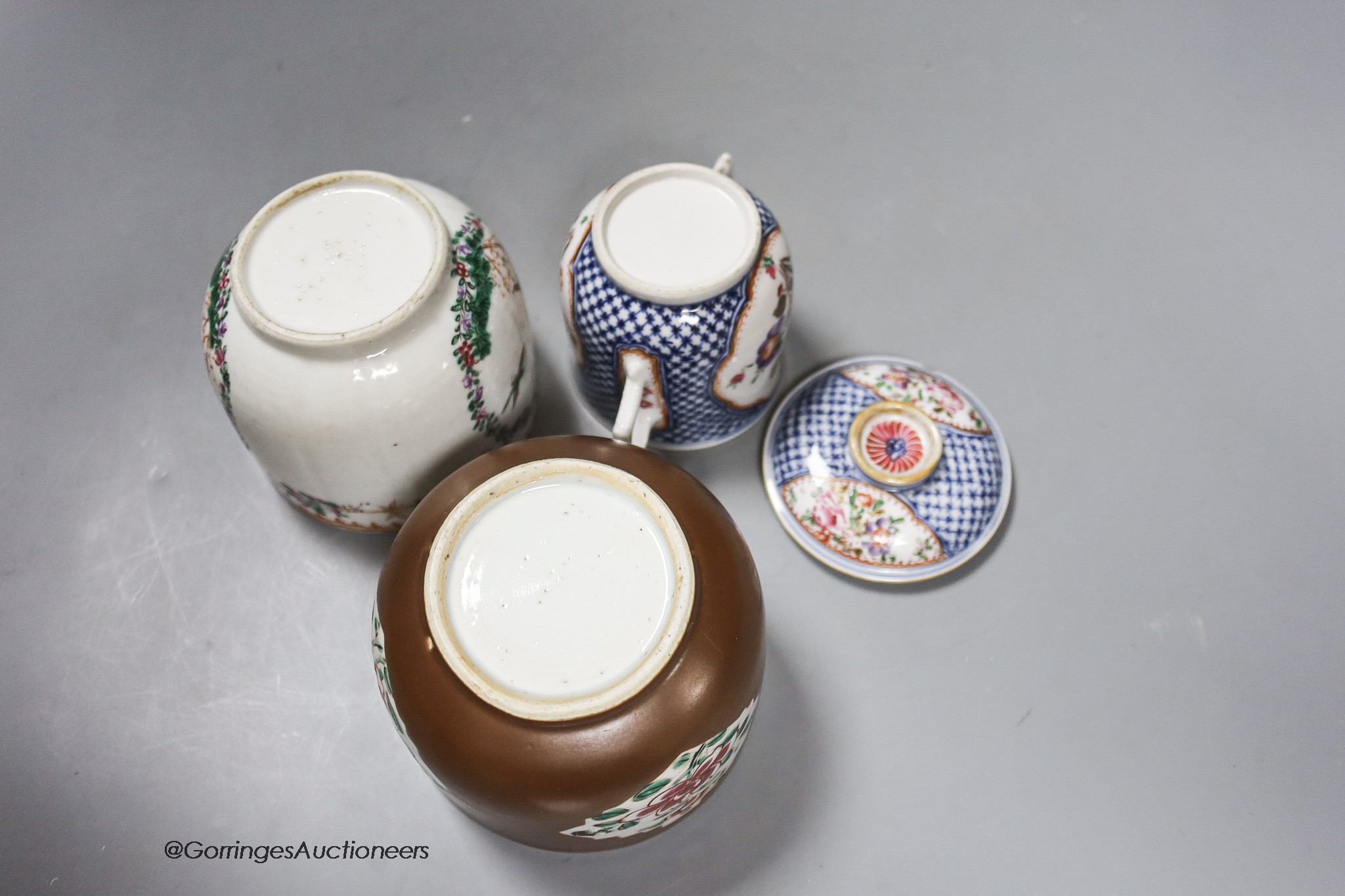 An 18th century Chinese export jar, lacking cover, a similar two handled jar and cover and a brown glazed jar